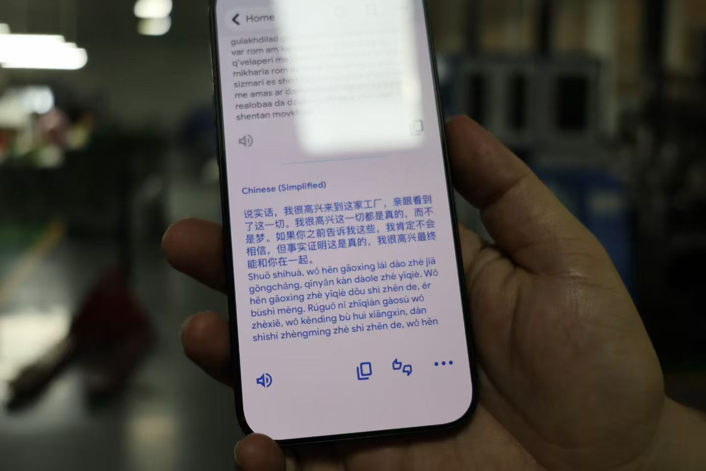 Translation app on phone screen showing buyer's real testimonial in his native language